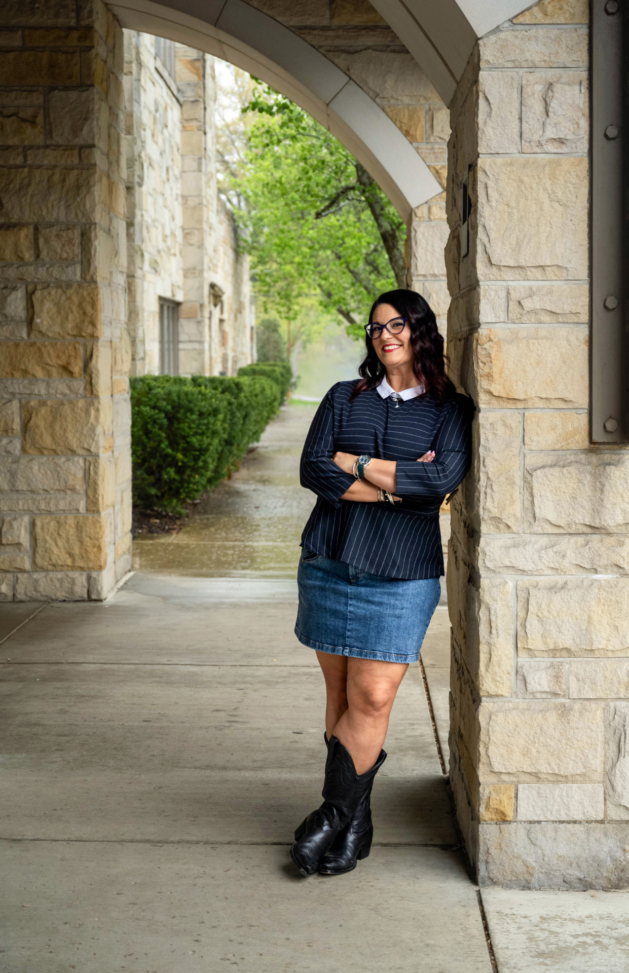Lisa Palmieri standing beneath a stone archway